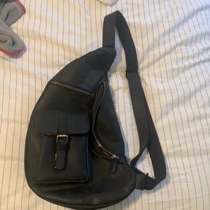 House of Flynn sling leather camera backpack